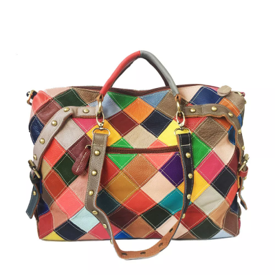 Retro Leather Bag is made of genuine leather with colorful diamond patch work throughout. Comes with 2 sets of matching shoulder straps accented with studs. Outside zipper pocket with PLENTY of room in the main compartment with two zipper pockets and two additional pockets on opposite side.